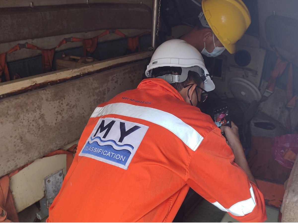 Surveyor inspecting a vessel hull during an annual survey