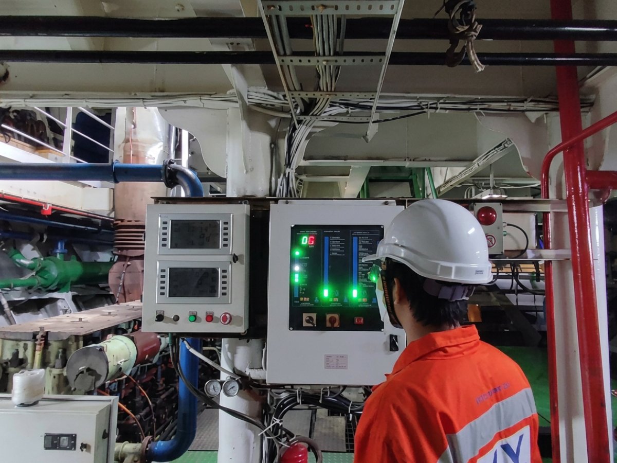 Surveyor inspecting machinery in the engine room during an annual survey